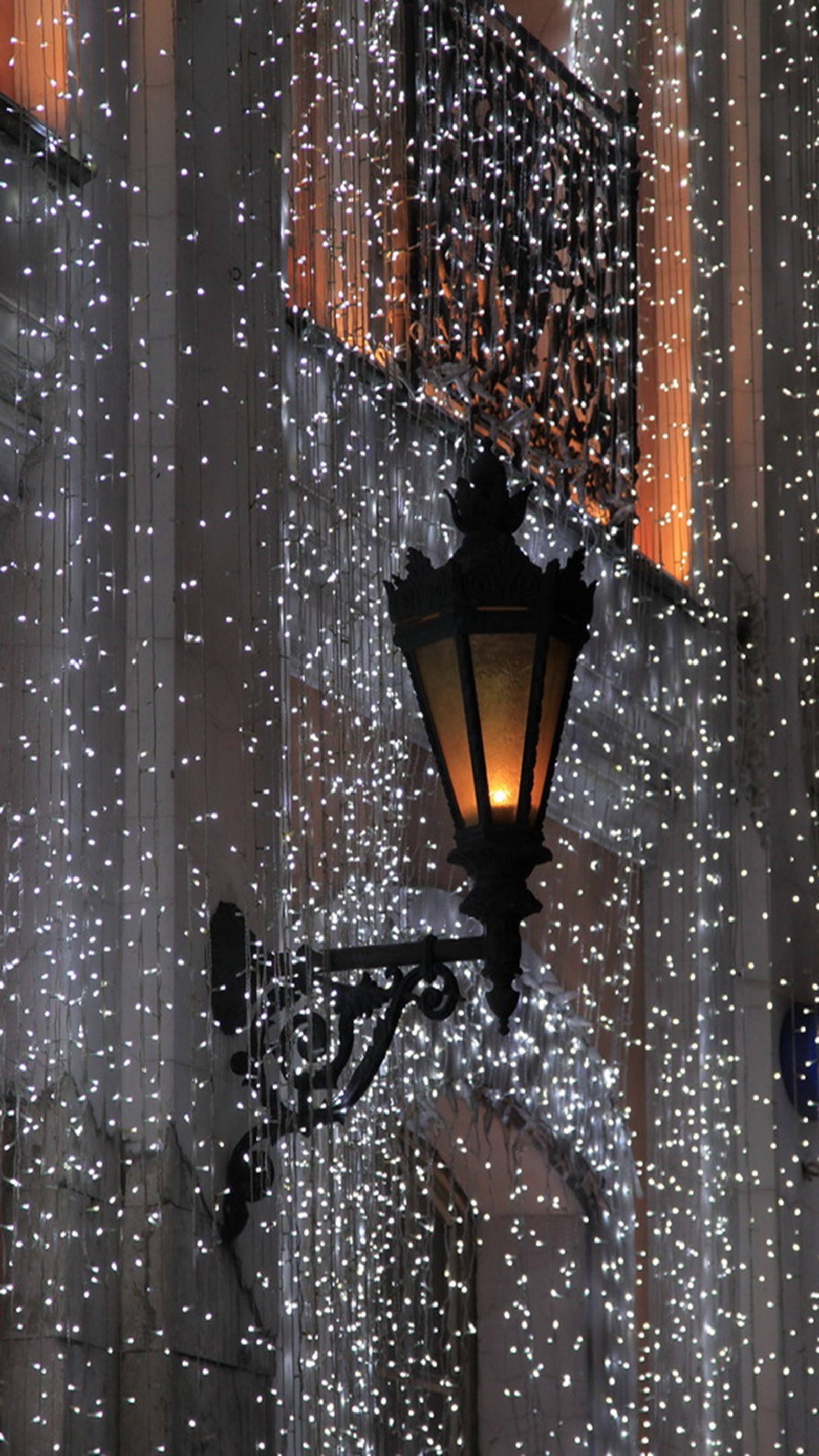 There is a street light that is lit up with lights (light, night)