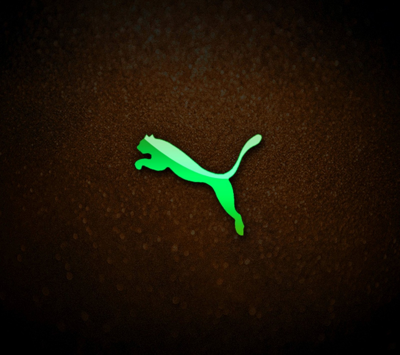 A close up of a green cat on a brown surface (green, logo, puma)