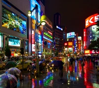 Vibrant City Nightlife: Rain-soaked Streets Under Colorful Lights