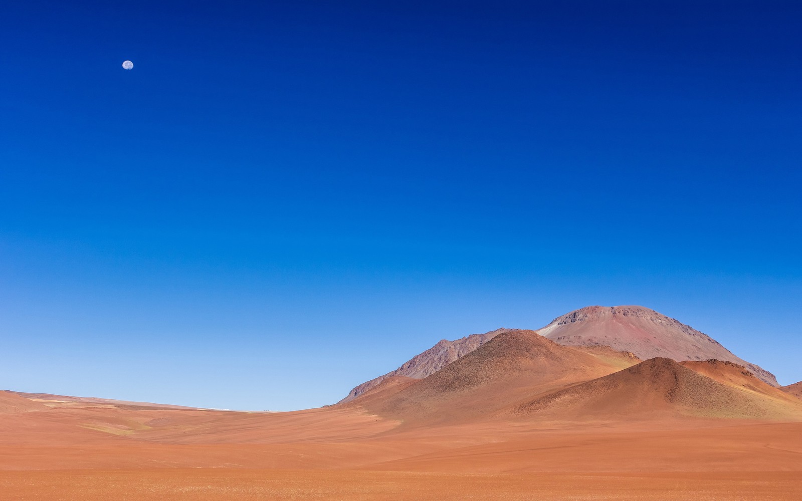 Arafed mountain in the distance with a blue sky and a moon (landscape, desert, landscape painting, aeolian landform, atmosphere)