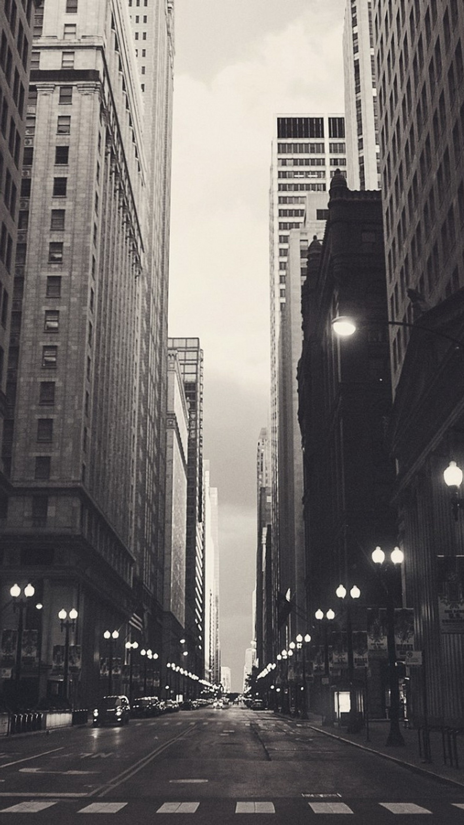 There is a black and white photo of a city street (chicago, financial)