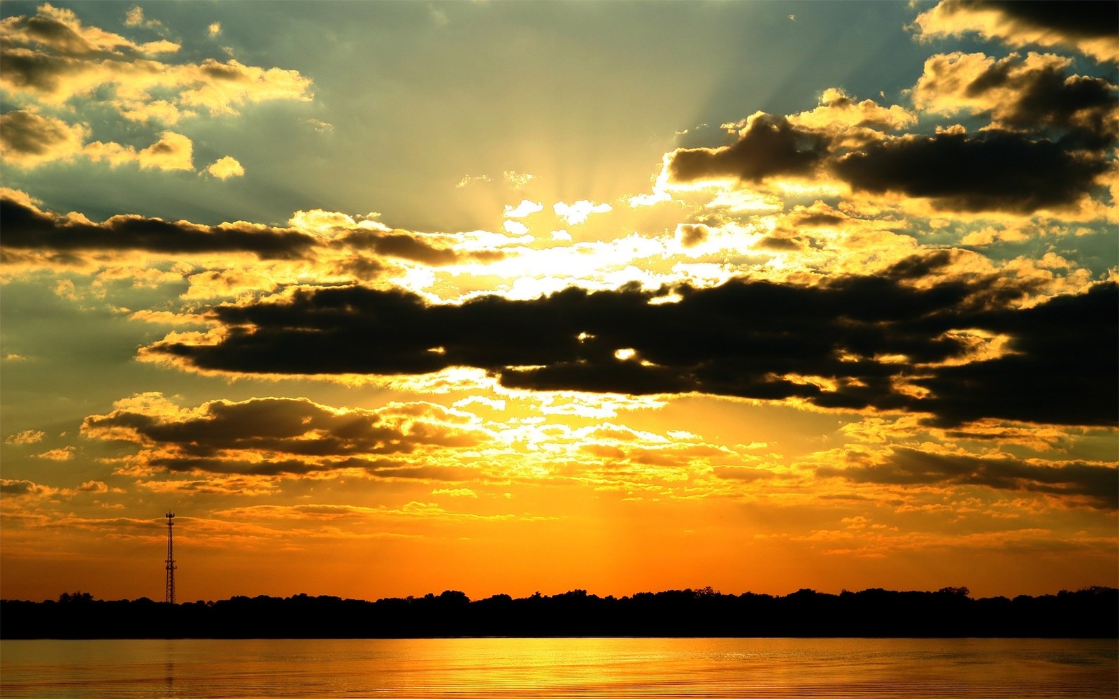 A view of a sunset over a body of water with clouds (sunset, afterglow, cloud, horizon, sun)