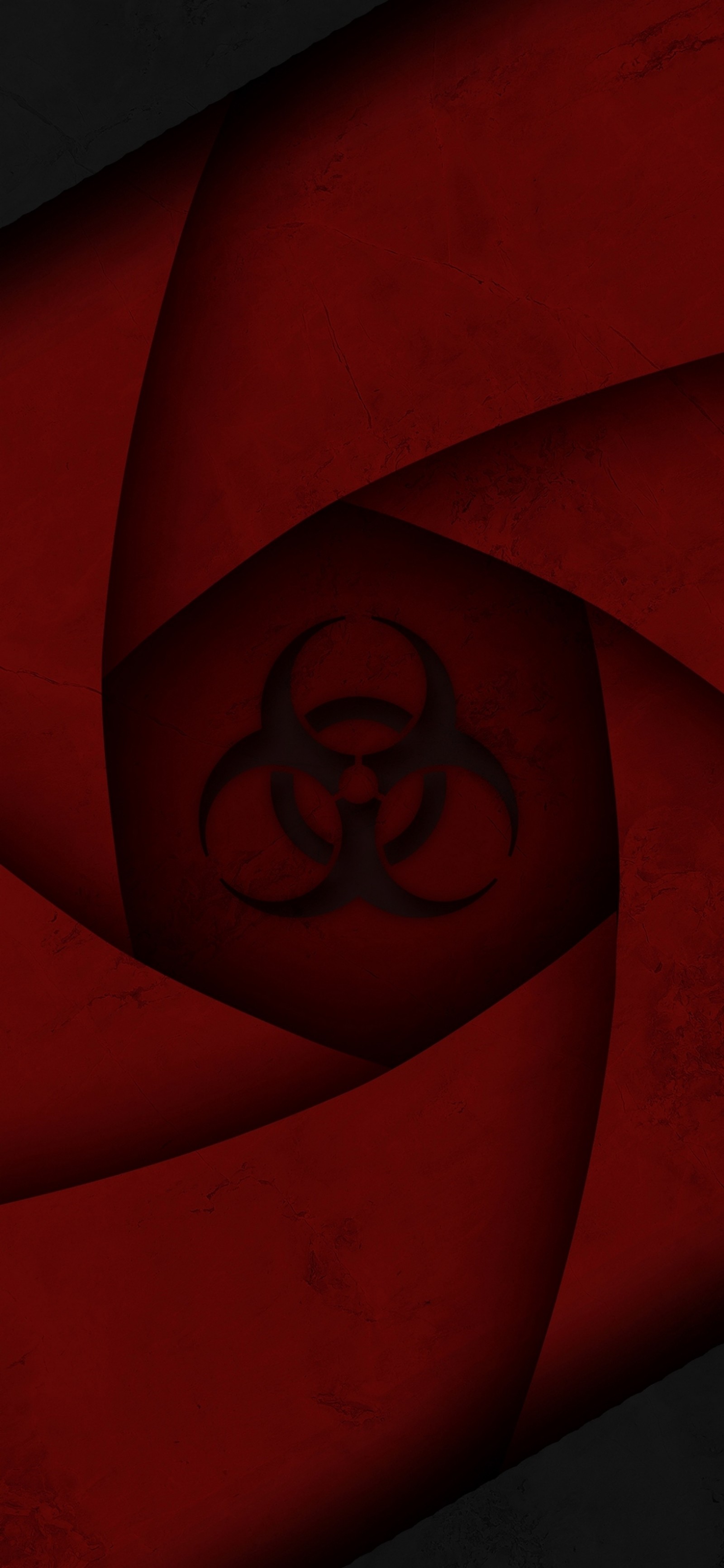 Gros plan d'un fond rouge et noir avec un symbole de biohazard (lumière, orange, ambre, bois, symétrie)