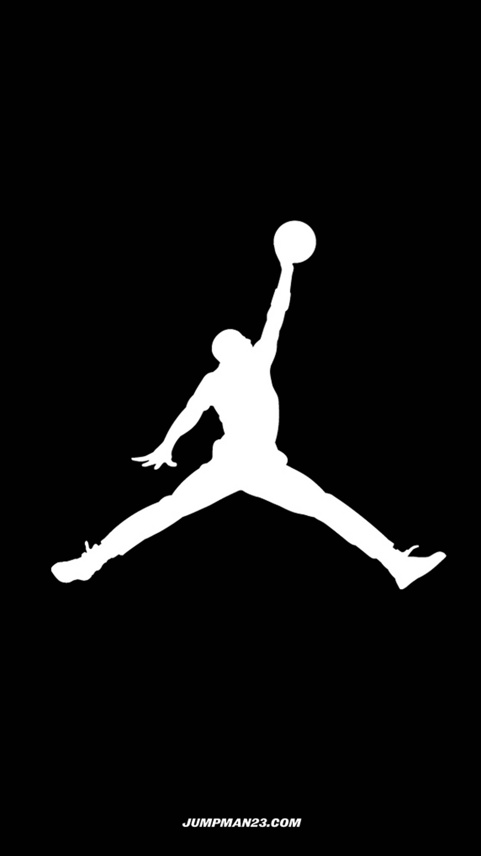 A close up of a person jumping with a basketball ball (basketball, jorden, jumpman, logo)