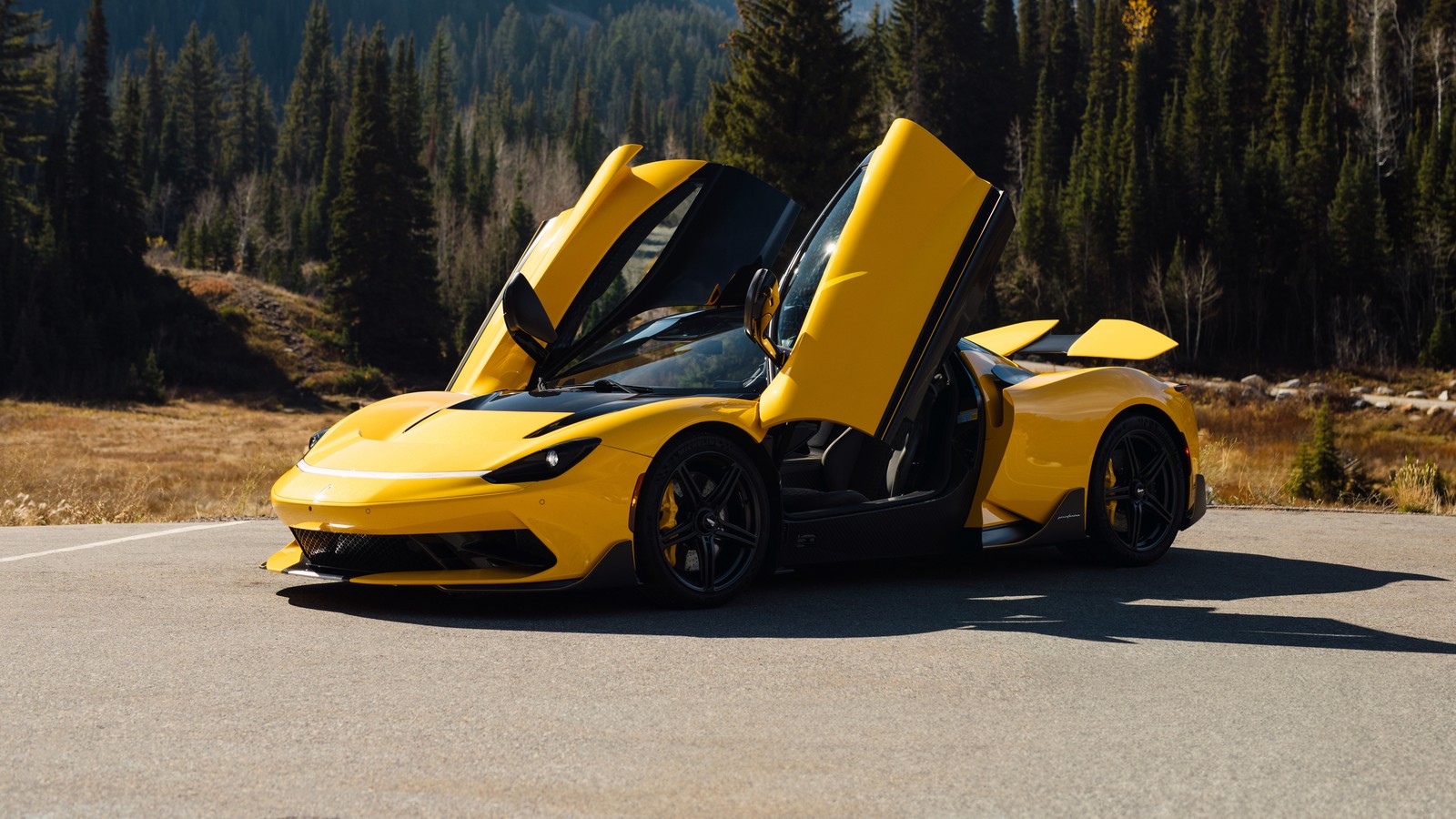 A yellow sports car with open doors on a road (pininfarina battista, electric cars, 5k, yellow cars, cars)