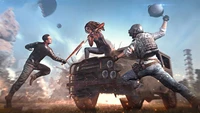 Intense combat scene in PUBG: Mobile featuring a fierce battle between players, with a dramatic backdrop of explosions and a military vehicle.