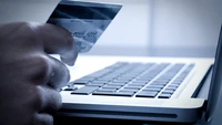 Seamless Online Payment Processing with Credit Card and Laptop