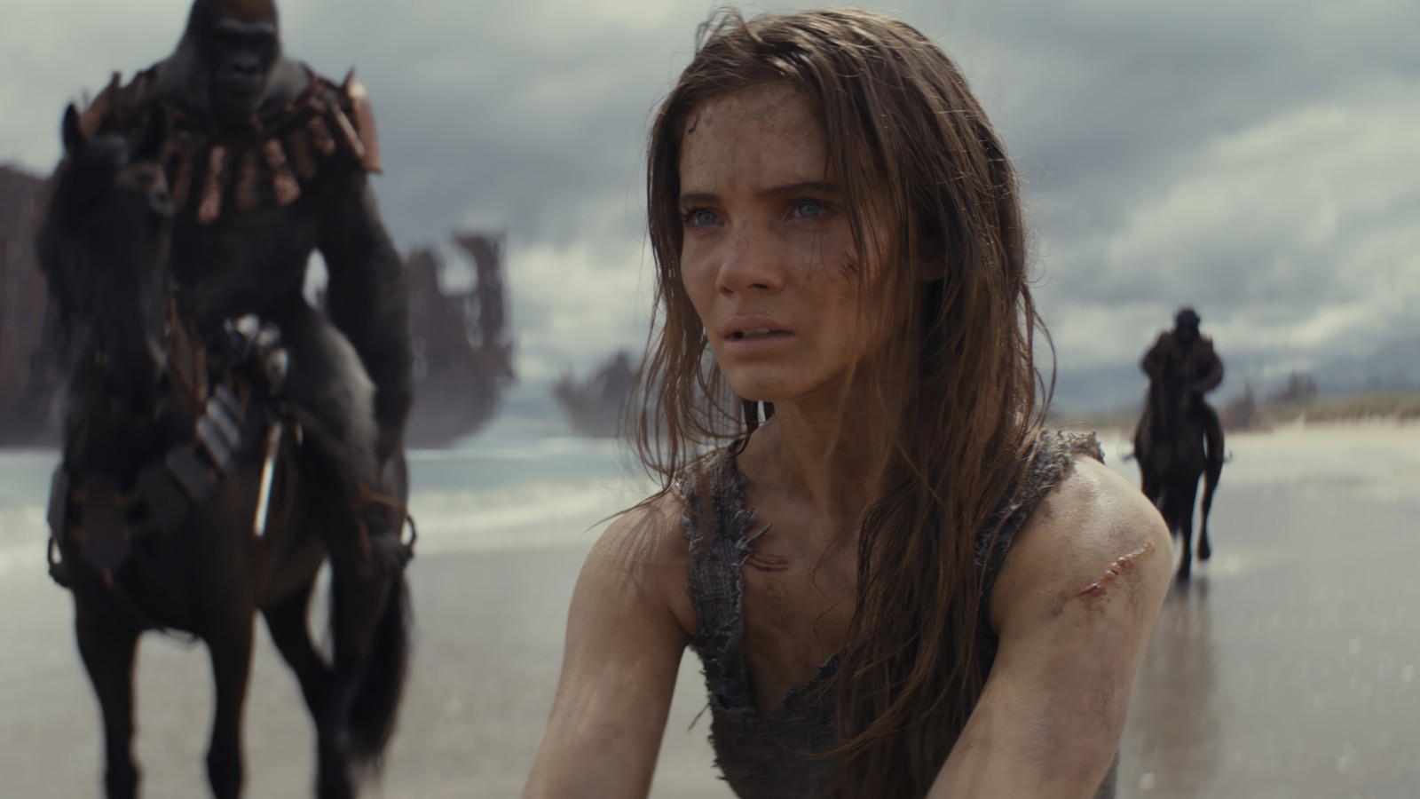 Arafed woman riding a horse on a beach with a man on a horse (kingdom of the planet of the apes, movie, proximus caesar, noa, freya allan)