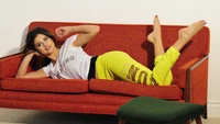 Selena Gomez Relaxing on a Couch in Casual Attire