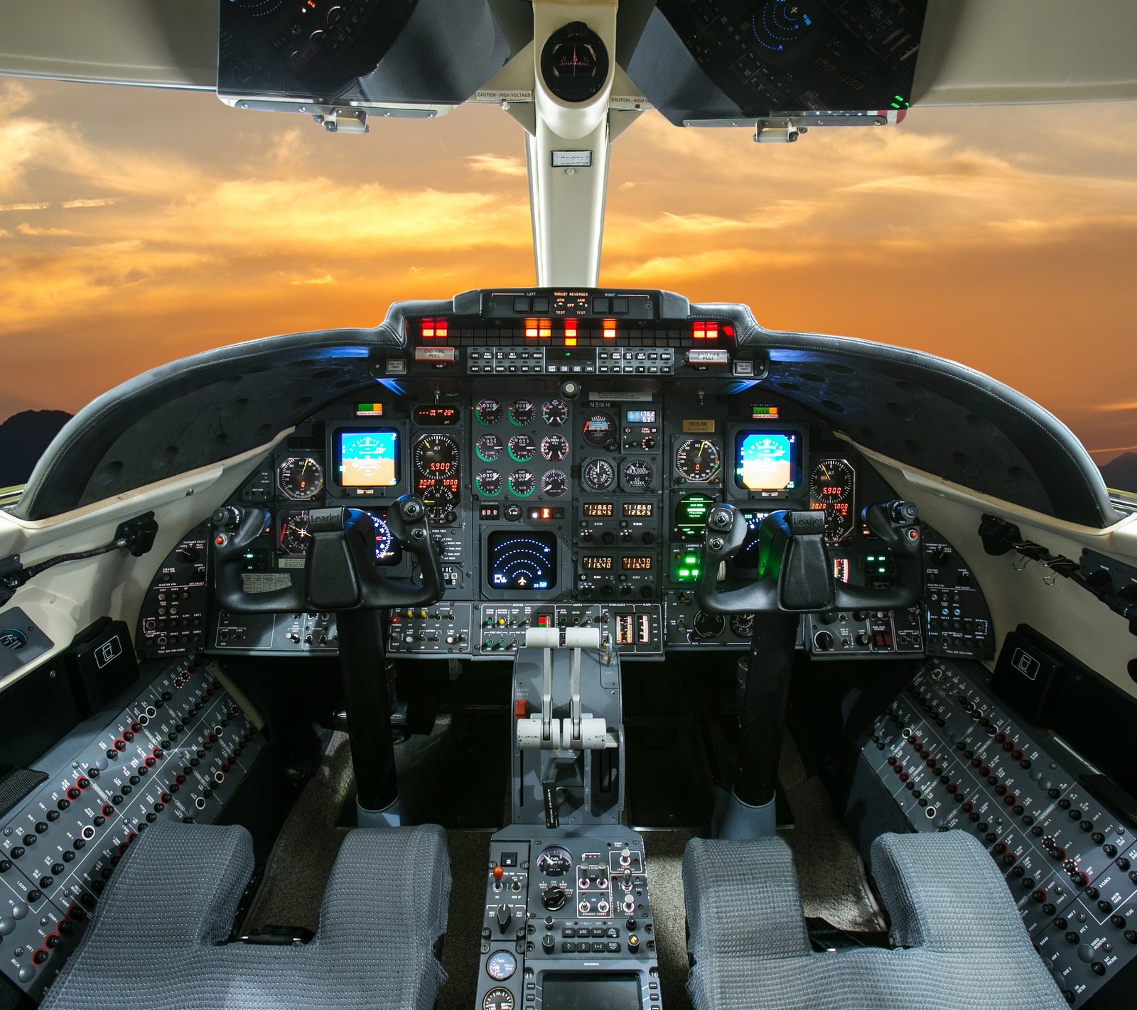 Arafed view of a cockpit with a view of the sunset (air craft, airplane, machine, plane, sky)