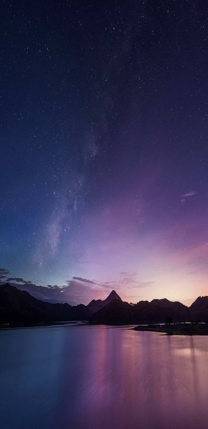 Purple and blue sky with stars and a mountain in the distance (plus, sunset, blue)