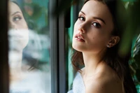 Elegant Portrait of a Beautiful Woman with Reflective Background