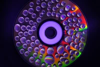 Colorful DVD with Water Droplets and Light Reflections