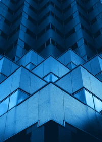 Symmetrical Modern Office Building with Geometric Blue Facade