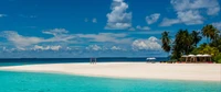 Tranquil beach scene in the Maldives with pristine white sand, clear turquoise waters, and lush palm trees under a vibrant sky.