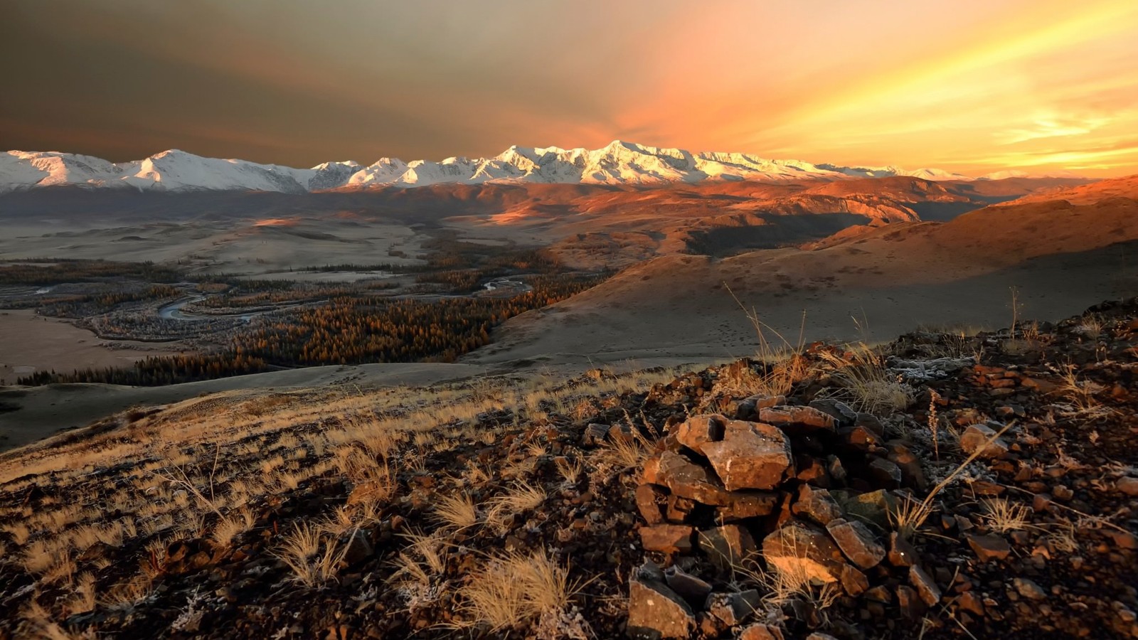 A view of a mountain range with a sunset in the background (altai mountains, mountain, highland, wilderness, tundra)