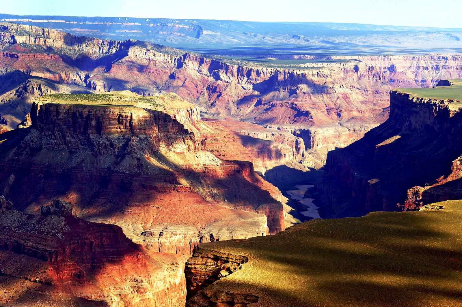 Araffe view of a canyon with a river running through it (badlands, canyon, formation, geology, macbook)