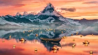 Tranquil Swiss Alps at Sunset with Floating Lanterns