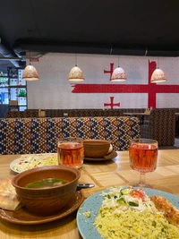 Georgian Breakfast Buffet: Colorful Dishware and Traditional Cuisine