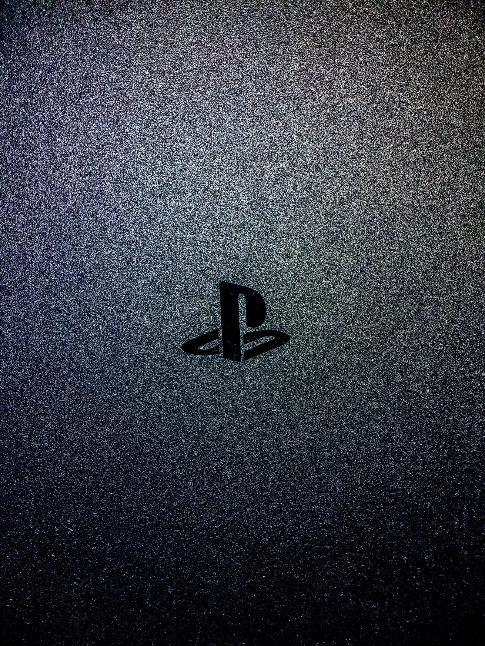 A close up of a playstation logo on a black background (technology, screen)