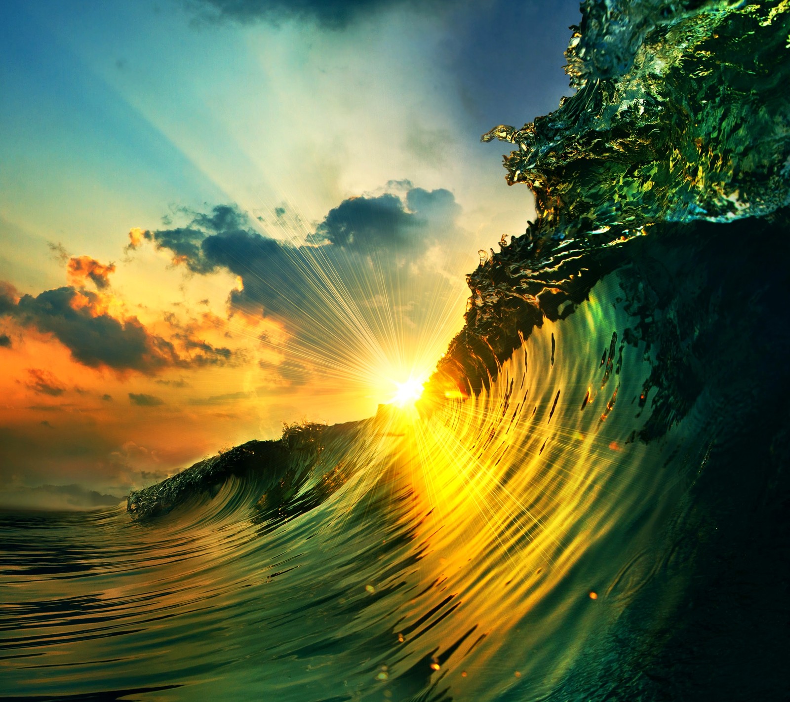 A close up of a wave with the sun setting in the background (clouds, green, sky, sunset, wave)