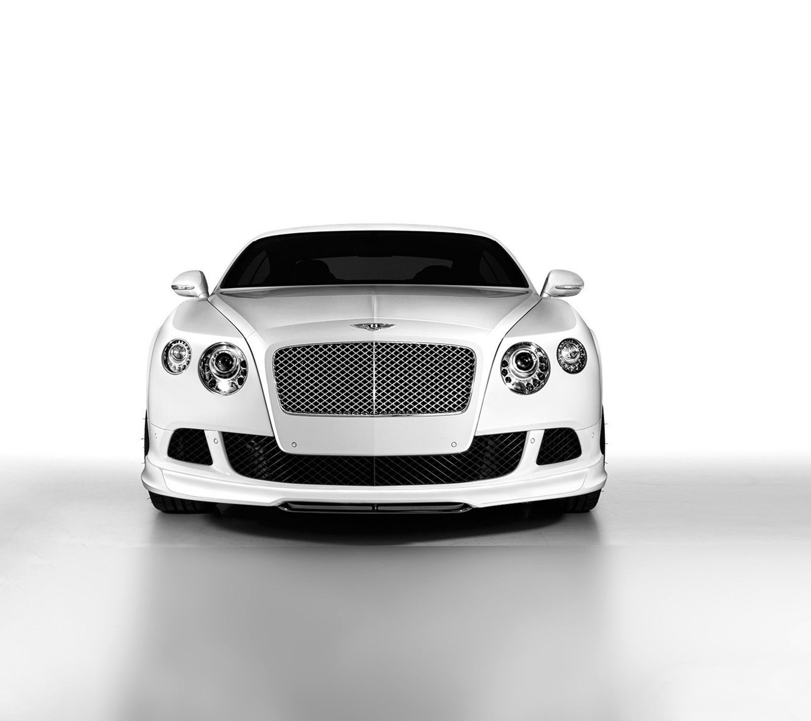 A close up of a white bentley car in a studio (angel, bentley, car, white)