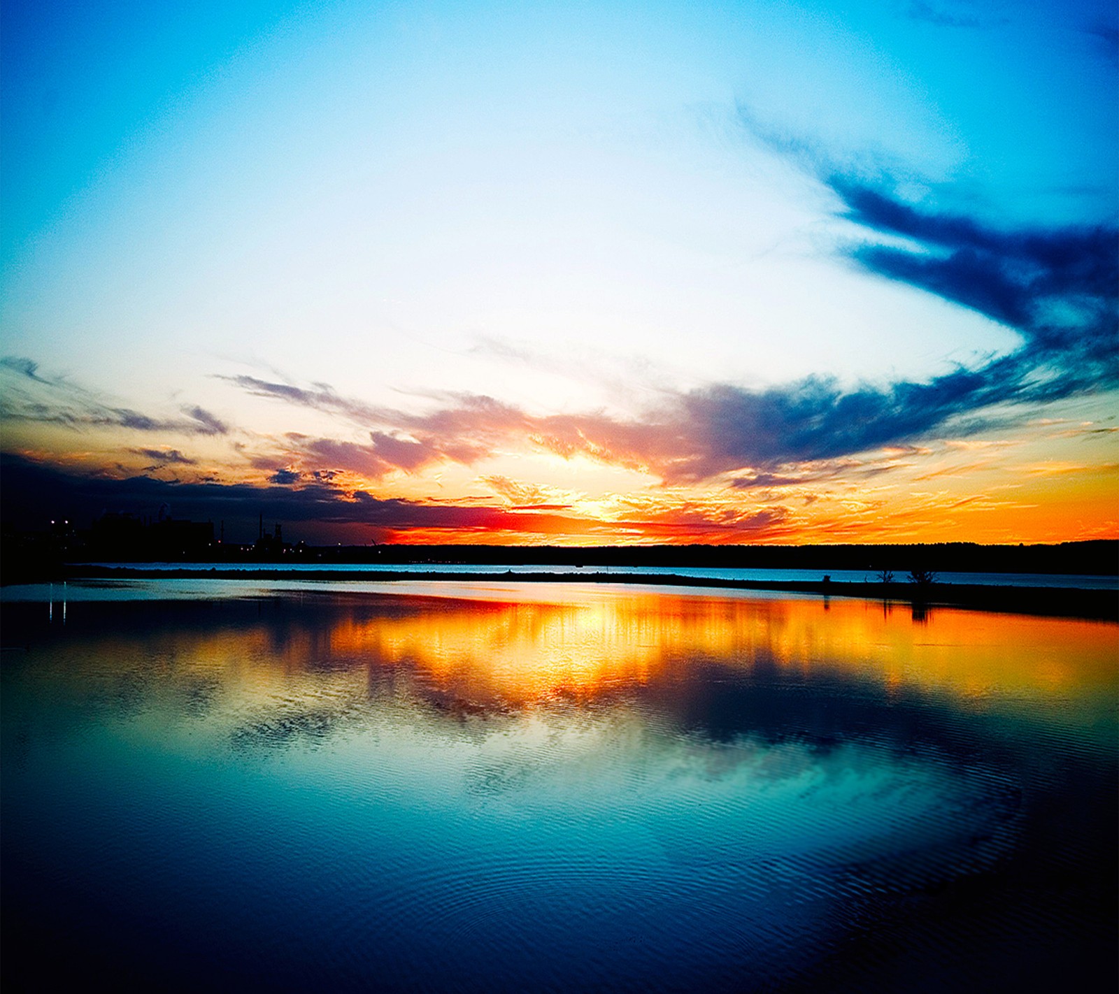 There is a person standing on the beach at sunset with a surfboard (nature, wallpaper)