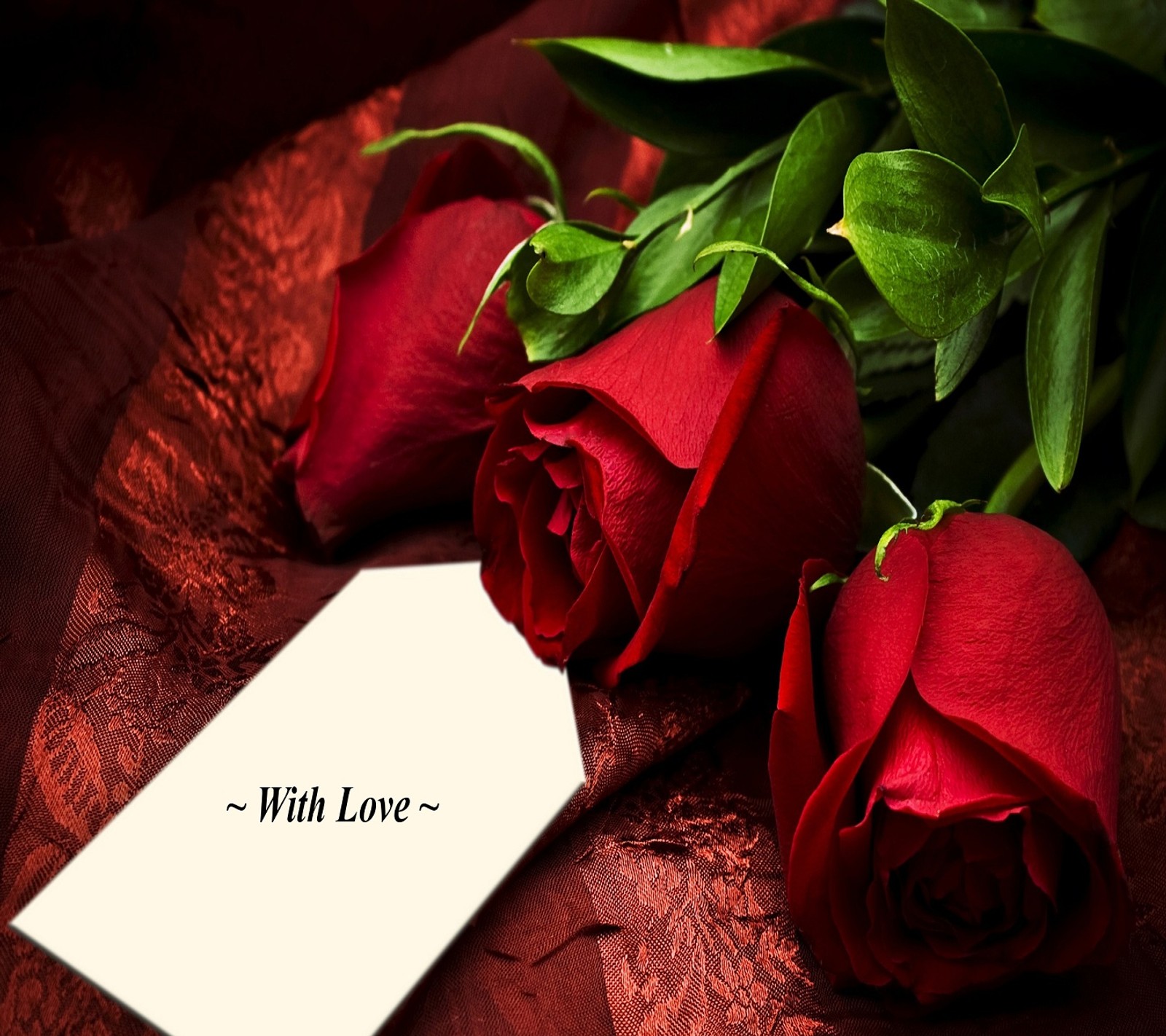 Roses and a card with a message on a table (love, roses)