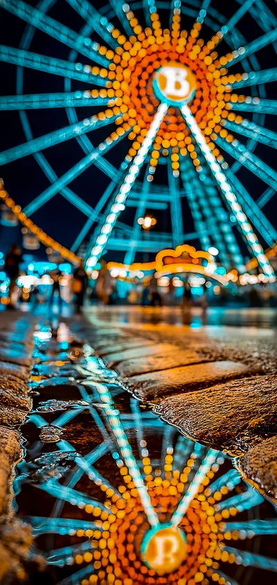 Réflexion de la grande roue illuminée dans un paysage nocturne