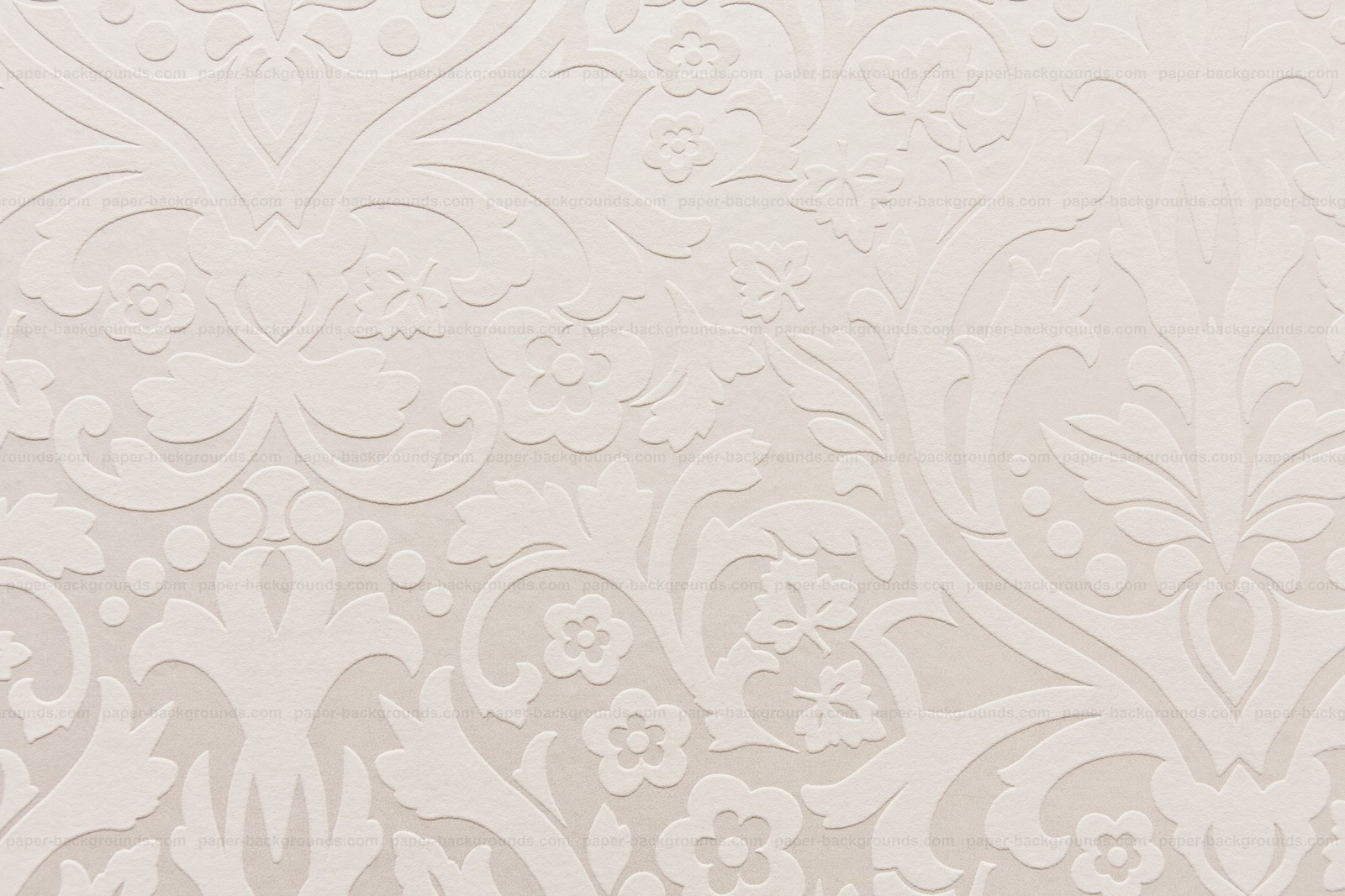 A close up of a white wall with a pattern on it (texture, pattern, design, paints, white)