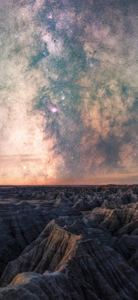 Majestic Milky Way Over Rugged Terrain at Dusk