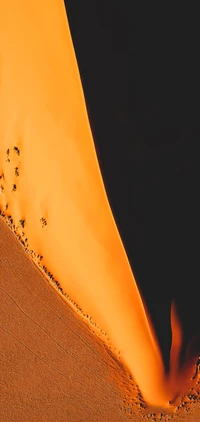 Amber Dunes: A Mesmerizing Slope of Orange Sands