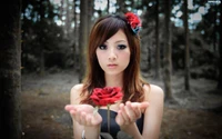 Enchanting Beauty: A Woman with a Red Rose in a Forest