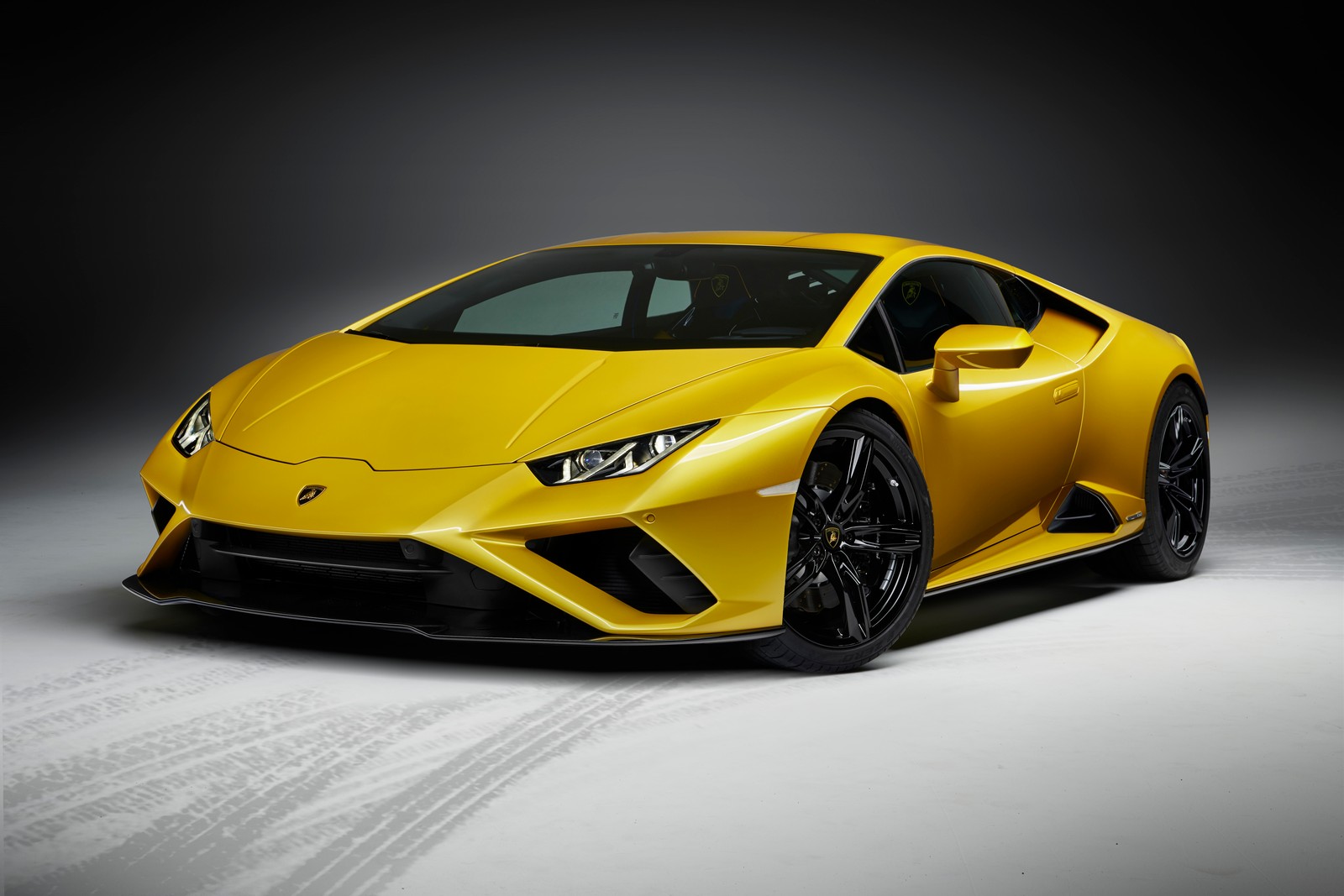 A yellow lamb sports car parked in a dark room (lamborghini huracan evo, 8k, 2020, 5k, cars)