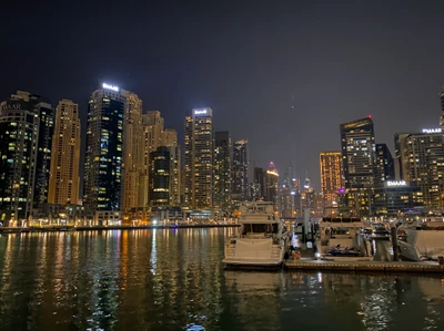 Dubai Marina: A Stunning Nighttime Cityscape with Skyscrapers and Reflections