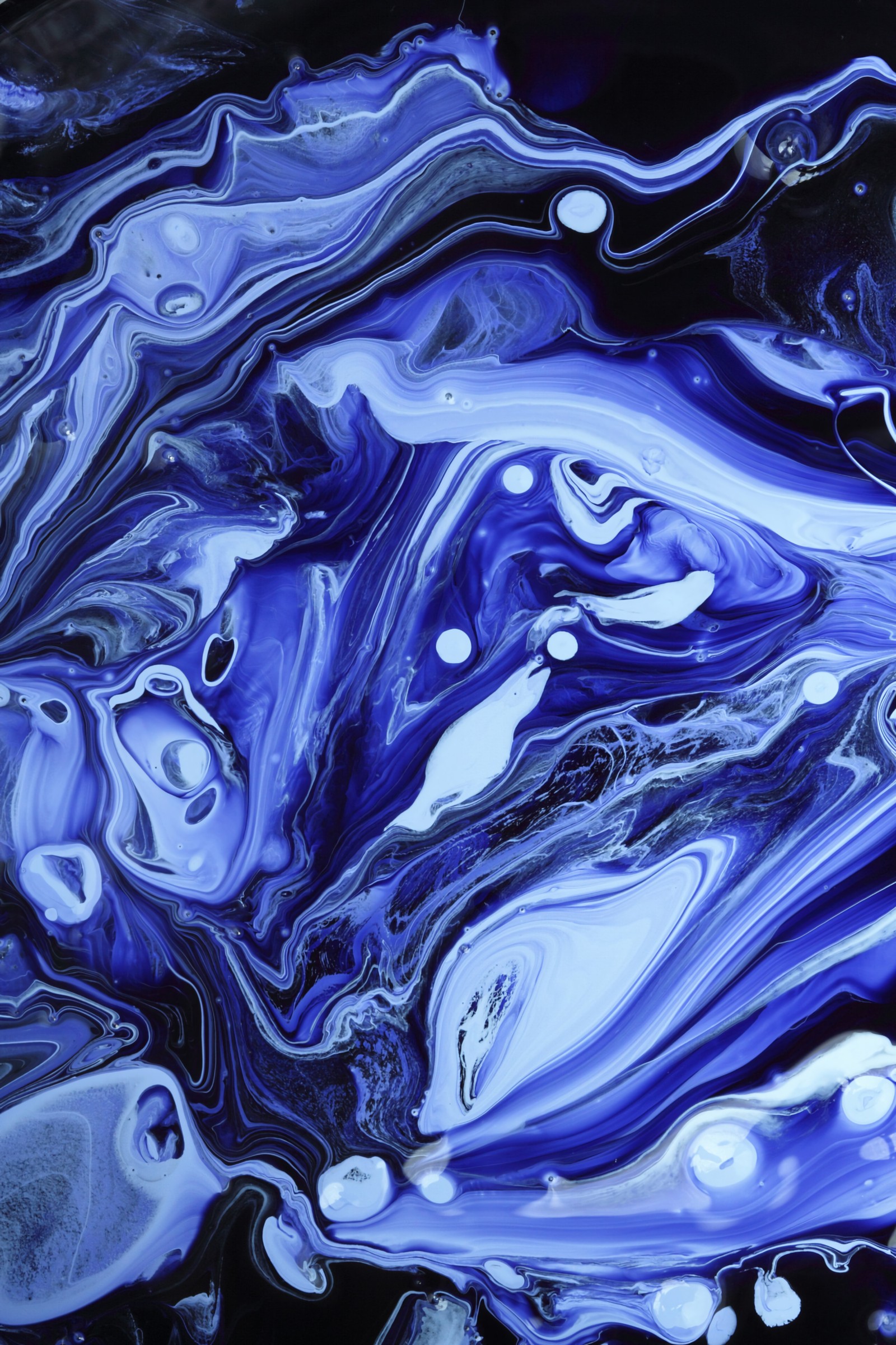 A close up of a painting of blue and white swirls (paint, liquid, water, blue, purple)