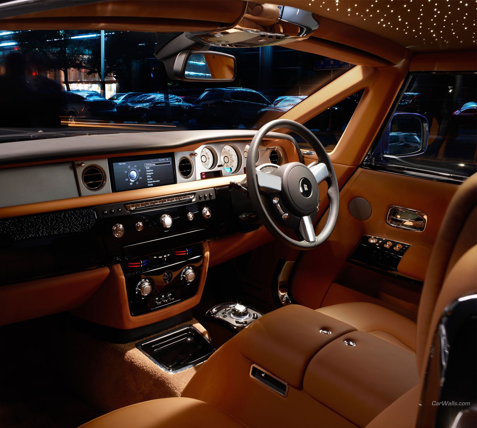 A close up of a car dashboard with a steering wheel and dashboard lights (auto, car, interior, phantom, rolls)