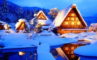 Enchanting Winter Wonderland: Snow-Covered Chalets Under a Blue Sky