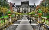 Majestic castle estate surrounded by lush gardens and scenic pathways in Yoho National Park.