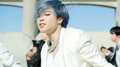 Jimin from BTS exuding charisma and style in a vibrant music video scene.