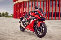 2022 Honda CBR500R: A Stunning Sports Bike Against a Modern Backdrop