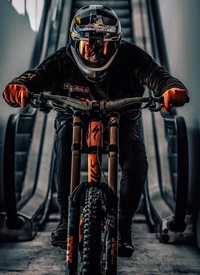 Mountain Biker Descending an Escalator