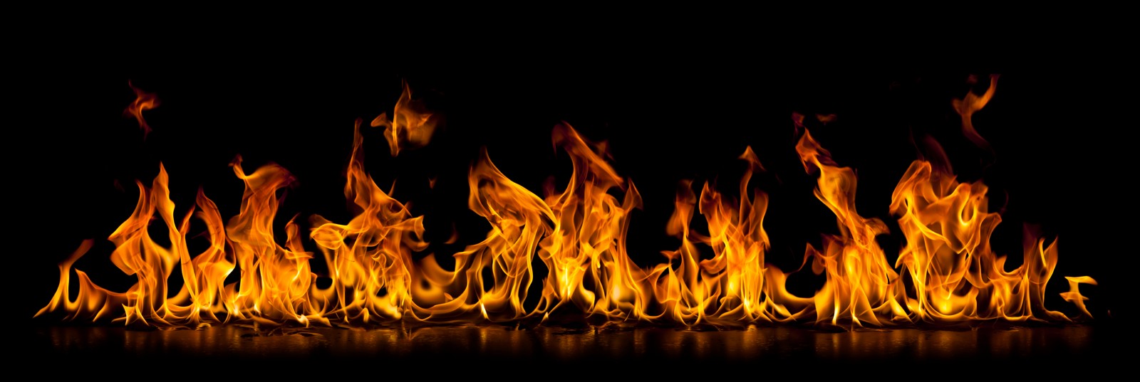 A close up of a fire on a black background (flame, fire, heat, bonfire, restaurant)