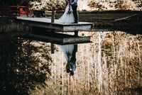 Romantic Wedding Reflection on a Serene Waterway