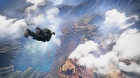 Parachuting into an expansive open world terrain under a dramatic sky.