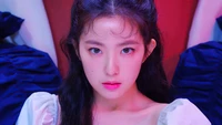 Irene from Red Velvet exuding confidence in a striking visual from the "Monster" music video.