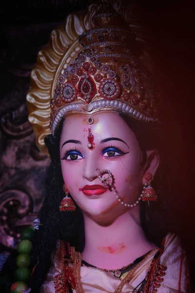 Devotional Idol of Goddess Durga with Ornate Jewelry and Vibrant Features