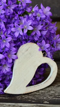 Heart-Shaped Accent Against a Vibrant Purple Bouquet