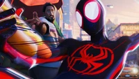 Miles Morales as Spider-Man in a vibrant animated scene from "Spider-Man: Across the Spider-Verse.