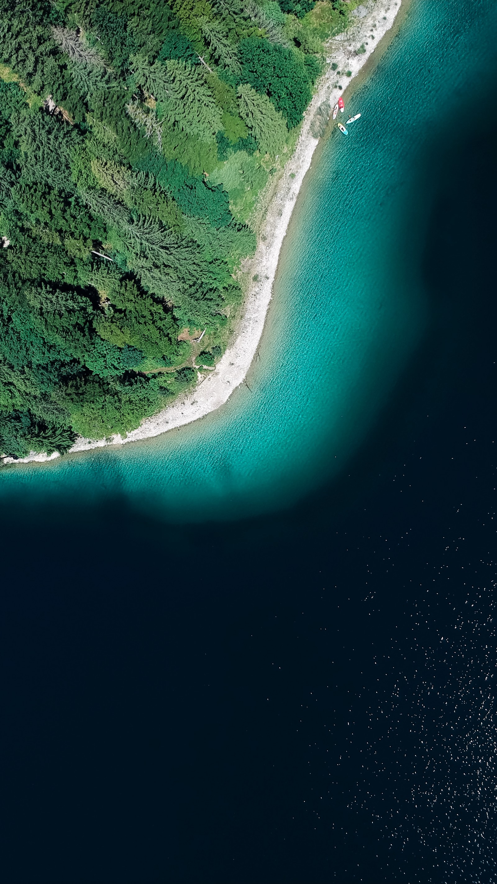 Arafed view of a body of water with a boat in it (water resources, earth, atmosphere, atmosphere of earth, water)